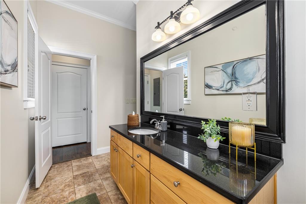 1258 DeKalb Avenue Northeast, Unit 135 Atlanta, GA 30307 - Photo 21 of 45 a bathroom with a sink and a mirror