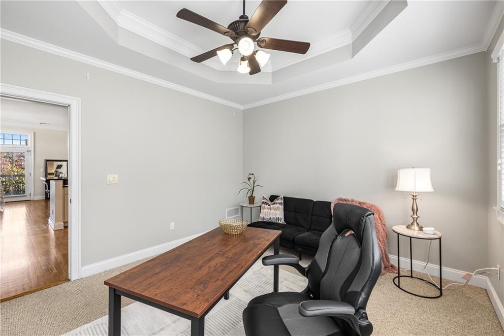 1258 DeKalb Avenue Northeast, Unit 135 Atlanta, GA 30307 - Photo 22 of 45 a room with furniture and a lamp