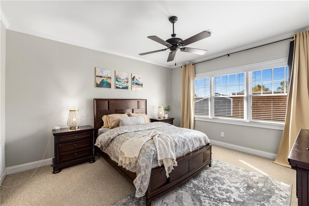 1258 DeKalb Avenue Northeast, Unit 135 Atlanta, GA 30307 - Photo 29 of 45 a bedroom with a large bed and a window