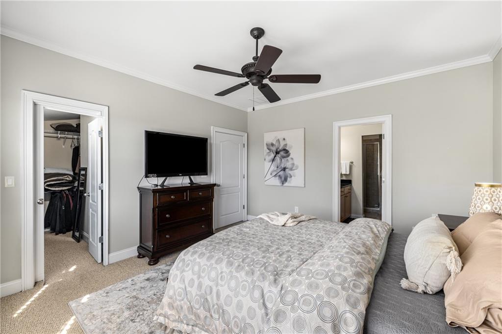 1258 DeKalb Avenue Northeast, Unit 135 Atlanta, GA 30307 - Photo 31 of 45 a bedroom with a bed and a flat screen tv