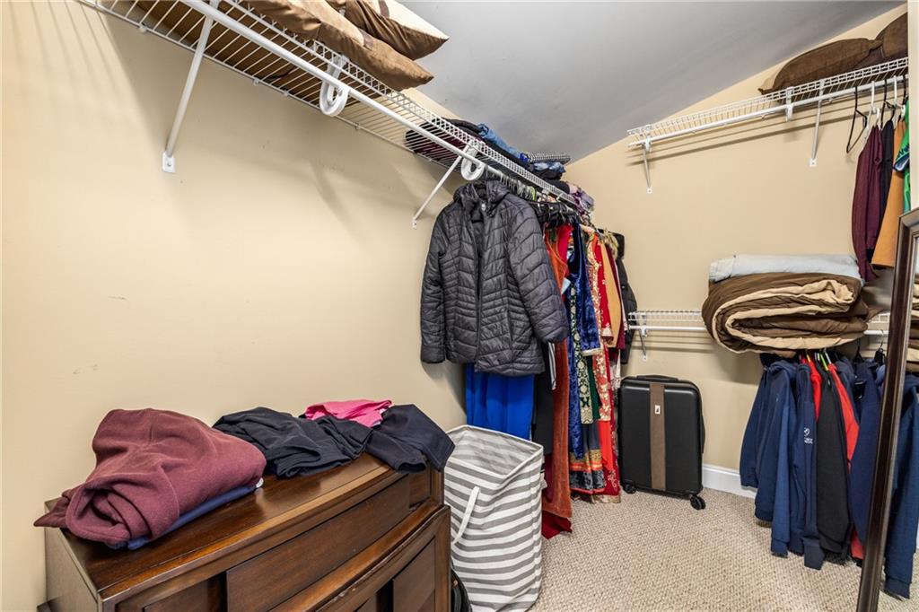 1258 DeKalb Avenue Northeast, Unit 135 Atlanta, GA 30307 - Photo 34 of 45 a view of walk in closet with clothes and shoes