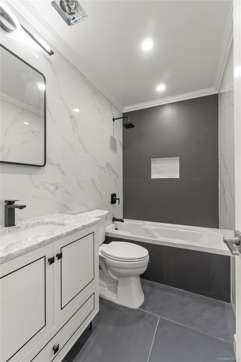 249-09 Mayda Road Queens, NY 11422 - Photo 24 of 28 a bathroom with a sink a toilet and mirror