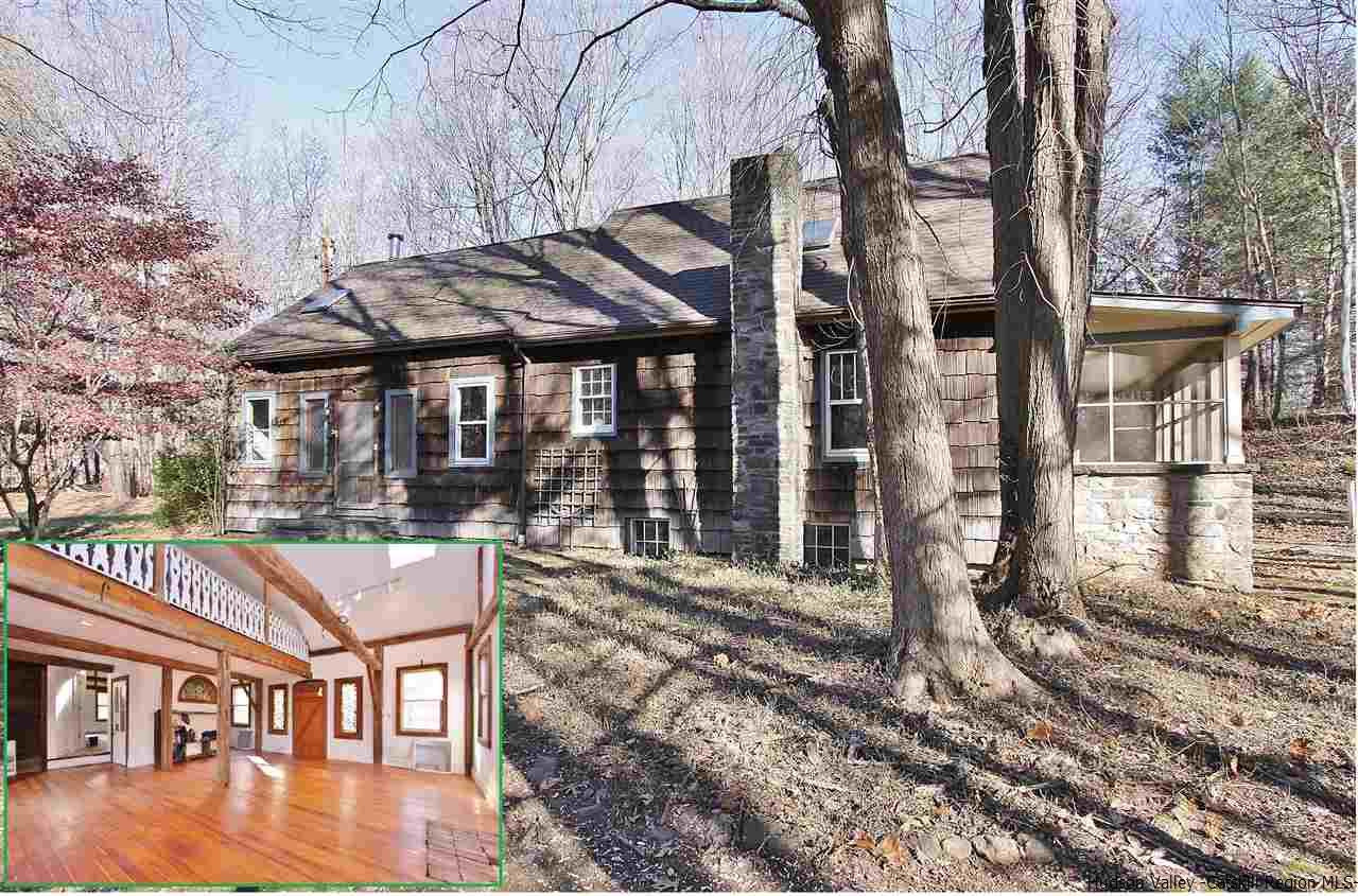 a view of a house with backyard porch and sitting area