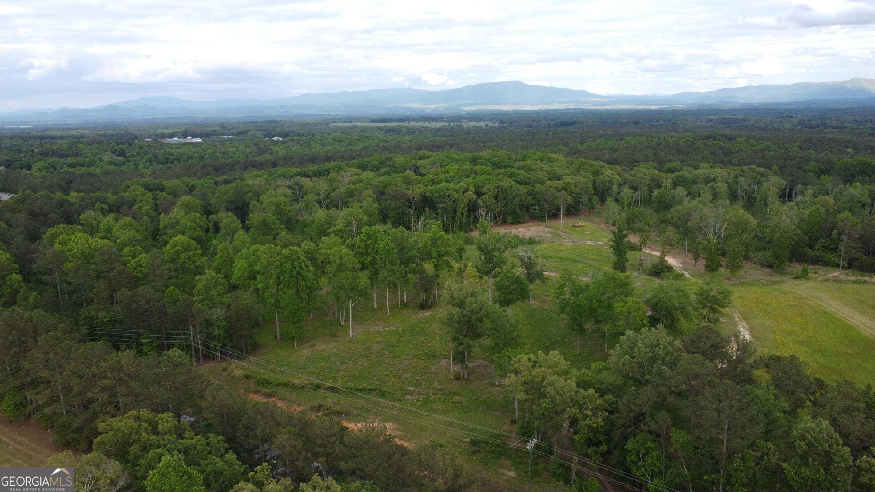 -tract 5 Highway 2 Dalton, GA 30721 - Photo 30 of 36 a view of a city with lush green forest