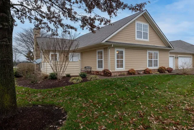 a front view of house with yard and green space