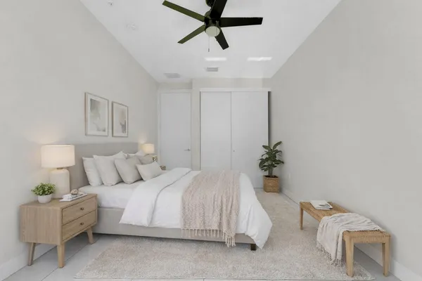 a bathroom with a sink toilet vanity and shower