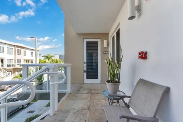 a view of a hallway with seating area