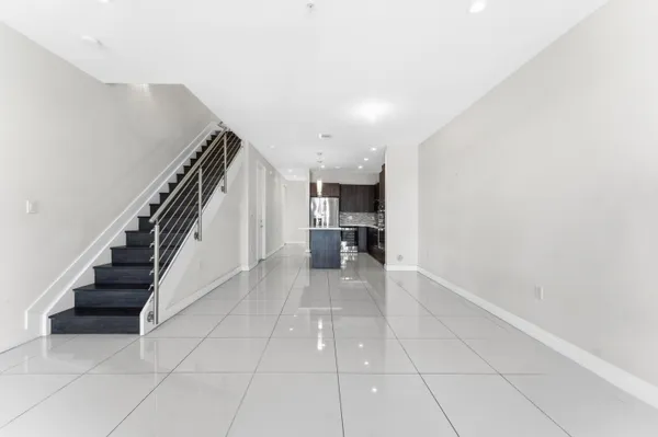 a view of entryway and kitchen