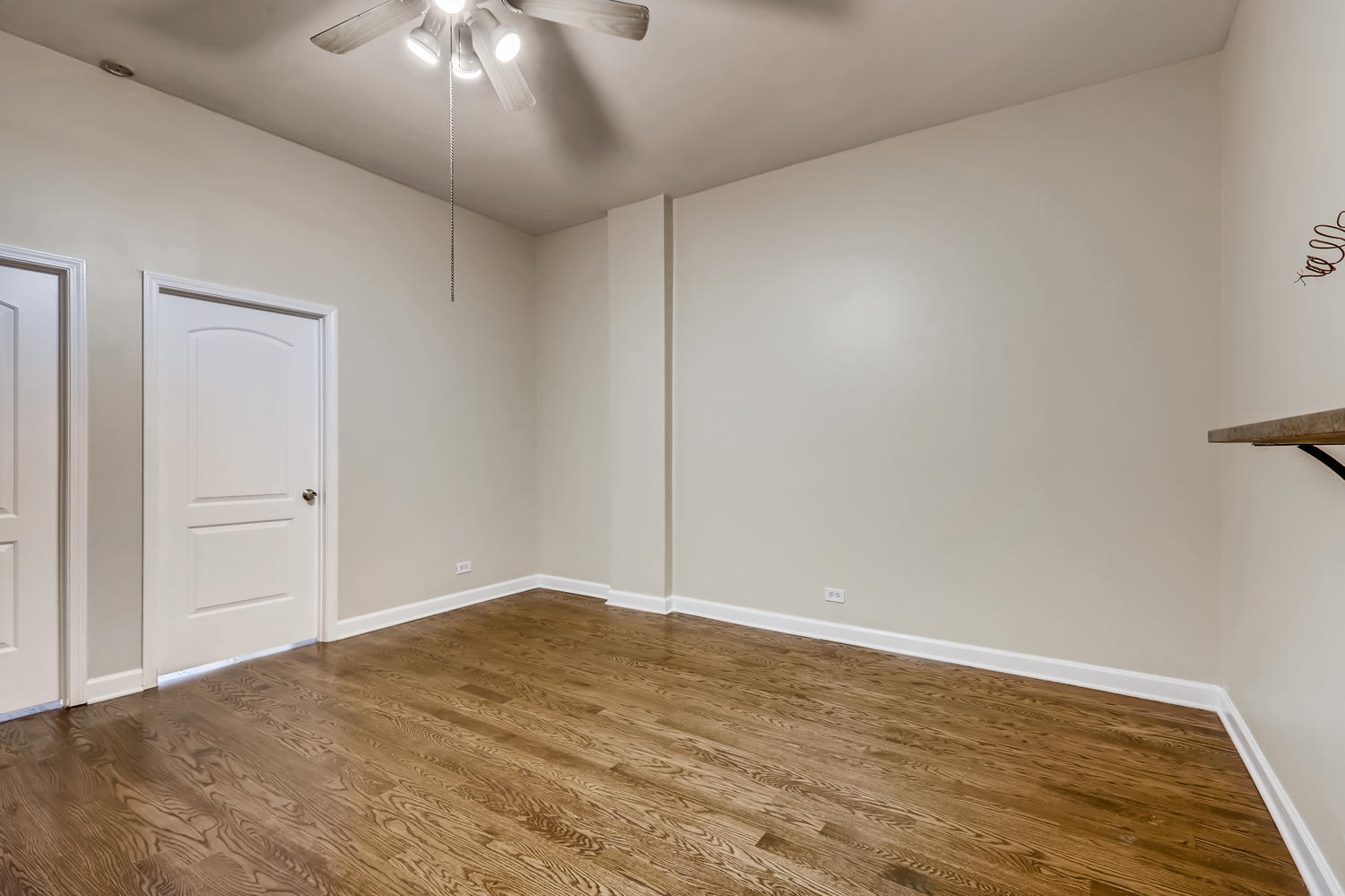7046 North Clark Street, Unit 2 Chicago, IL 60626 - Photo 2 of 11 a view of an empty room with wooden floor