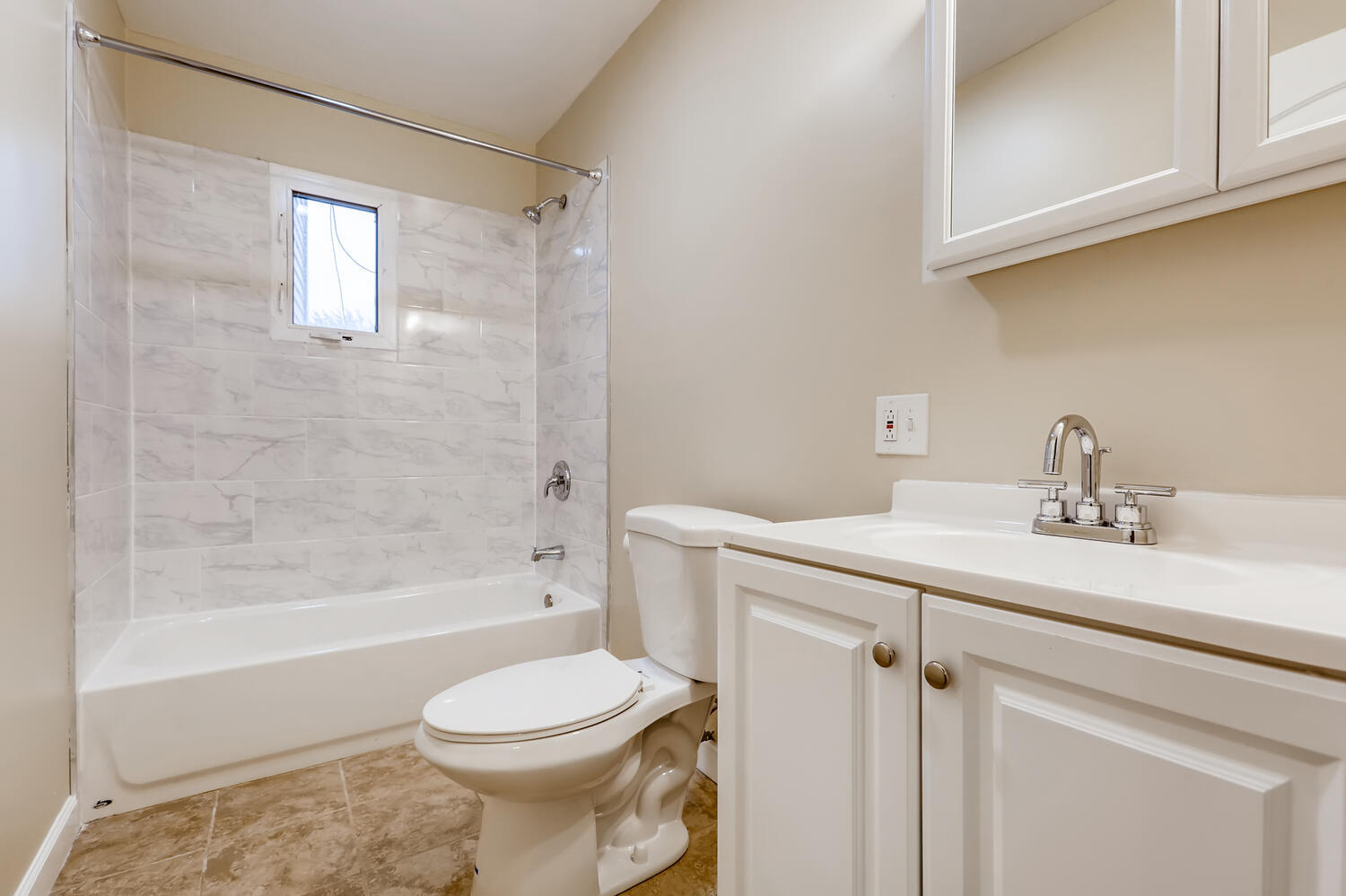 7046 North Clark Street, Unit 2 Chicago, IL 60626 - Photo 8 of 11 a bathroom with a sink a toilet and shower