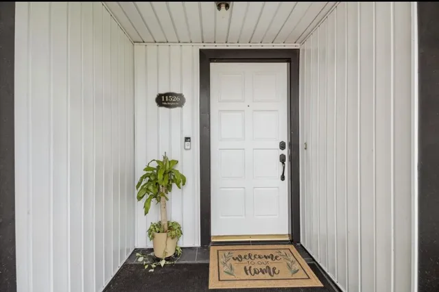a view of a hallway with entryway
