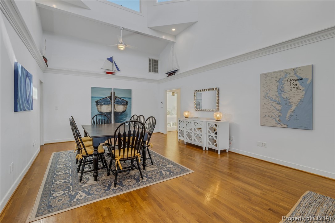 192 Bayberry Point Lane Kilmarnock, VA 22482 - Photo 18 of 49 Dining area with light hardwood flooring and a high ceiling