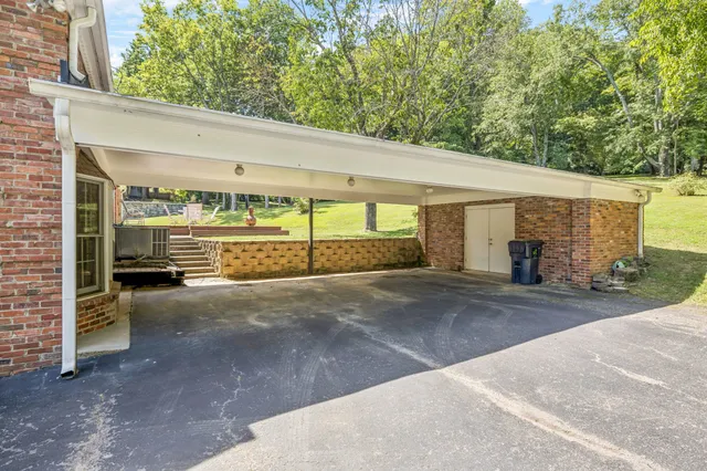 a view of yard with swimming pool and trees