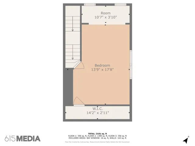 a view of a livingroom with furniture and chandelier fan