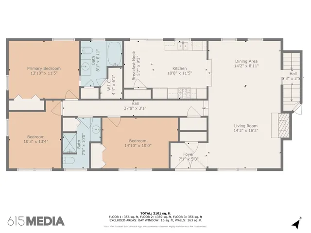 a view of empty room with wooden floor and fireplace