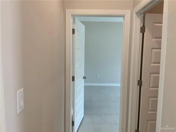 a bathroom with a shower and a sink