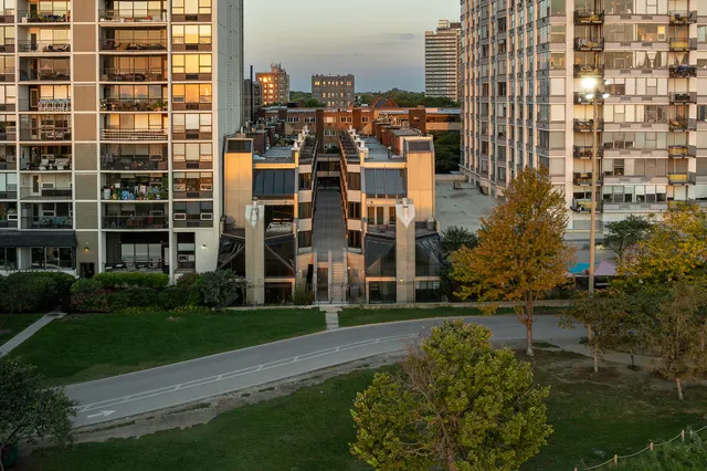 a view of a building with a yard