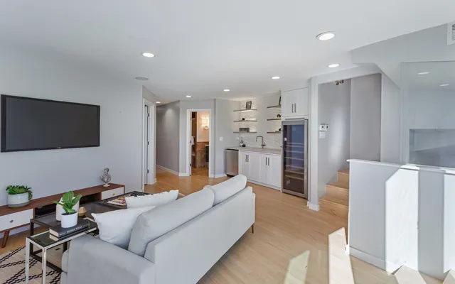a kitchen with cabinets and window