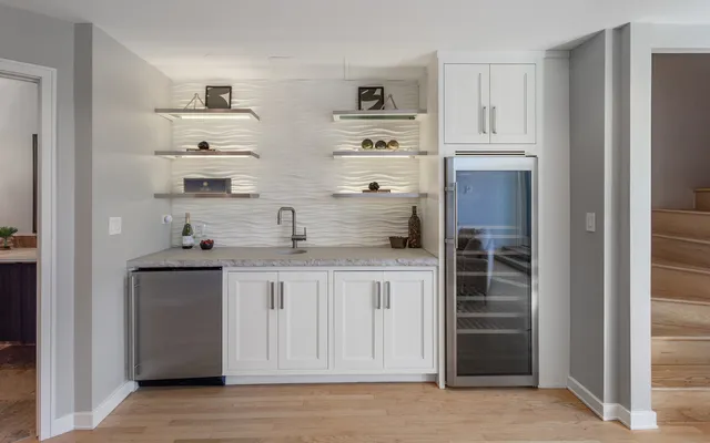 a view of a roof deck with couches and wooden floor