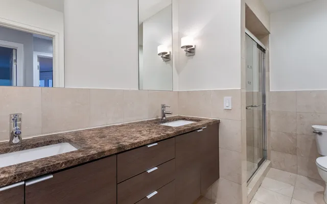 a living room with patio furniture and a fireplace