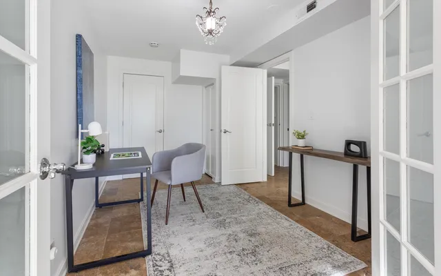 a view of a livingroom with furniture and a window