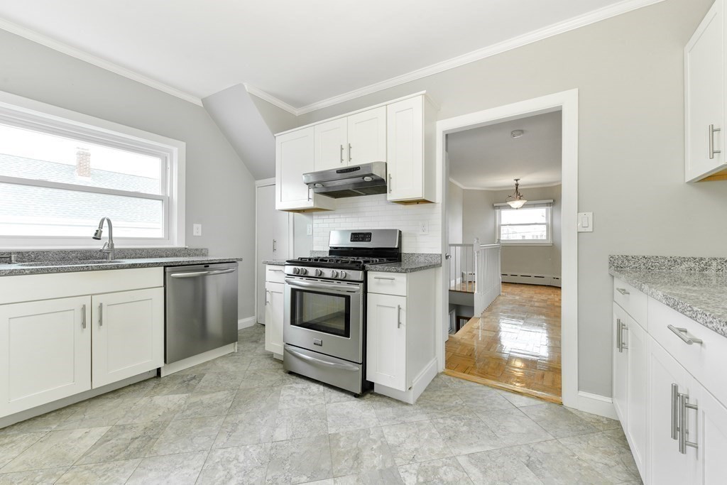 40 Bosson Street, Unit 2 Revere, MA 02151 - Photo 1 of 13 a kitchen with white cabinets and appliances
