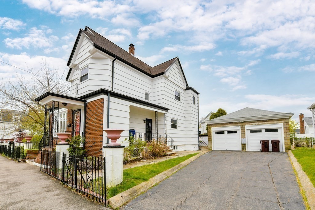 40 Bosson Street, Unit 2 Revere, MA 02151 - Photo 12 of 13 a front view of a house with parking area