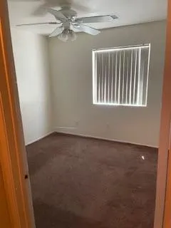 a view of a room with a fan and a fan