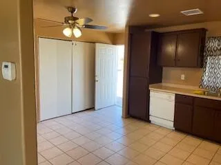 a kitchen with a sink and a refrigerator