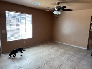 a view of room with a window and ceiling fan