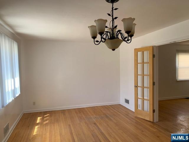 279 Slocum Way Fort Lee, NJ 07024 - Photo 3 of 20 a view of a room with wooden floor and windows