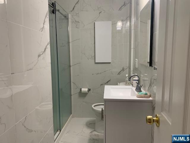 279 Slocum Way Fort Lee, NJ 07024 - Photo 8 of 20 a bathroom with a sink toilet and shower