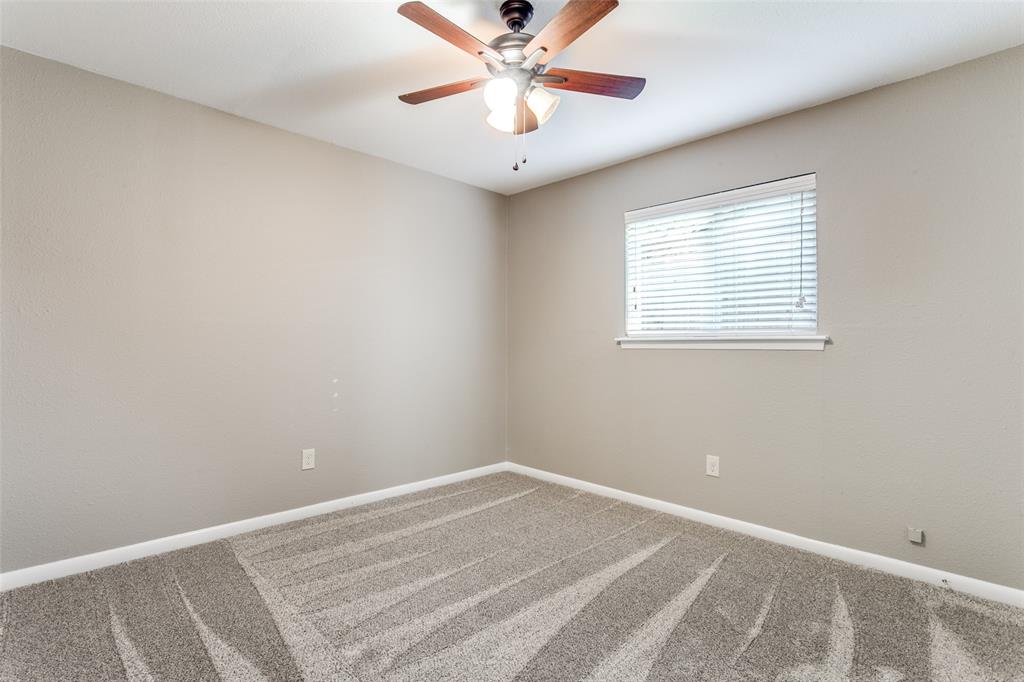 845 Lovers Lane Grapevine, TX 76051 - Photo 16 of 24 an empty room with a window and a fan