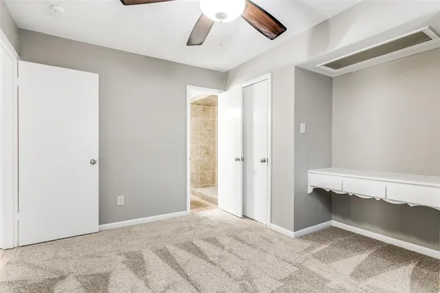 a view of room with window and ceiling fan