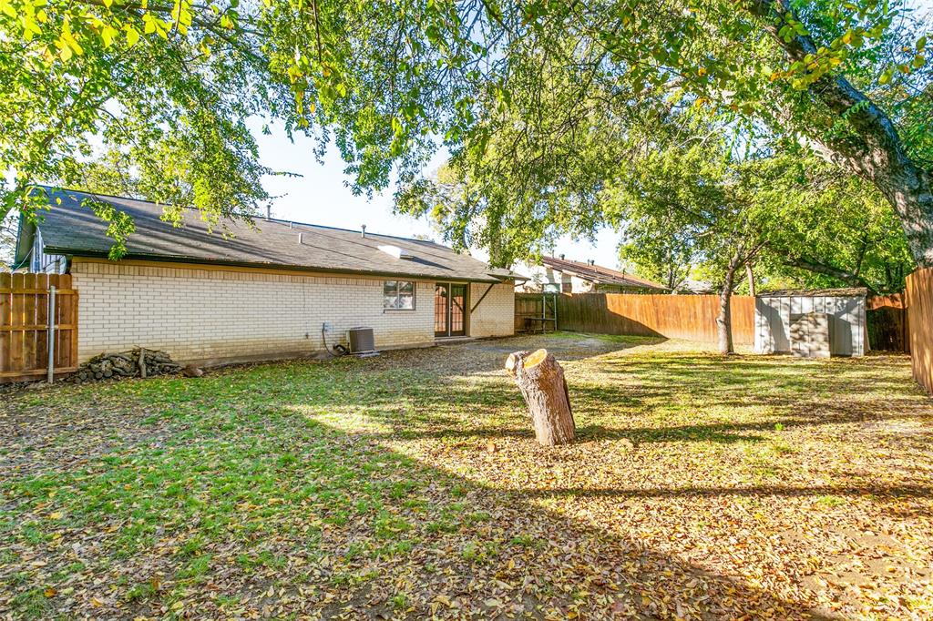 845 Lovers Lane Grapevine, TX 76051 - Photo 22 of 24 a view of a house with a backyard