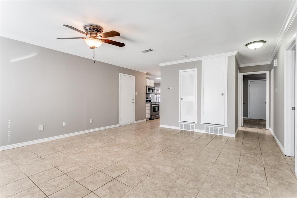 845 Lovers Lane Grapevine, TX 76051 - Photo 5 of 24 a view of an empty room with a ceiling fan