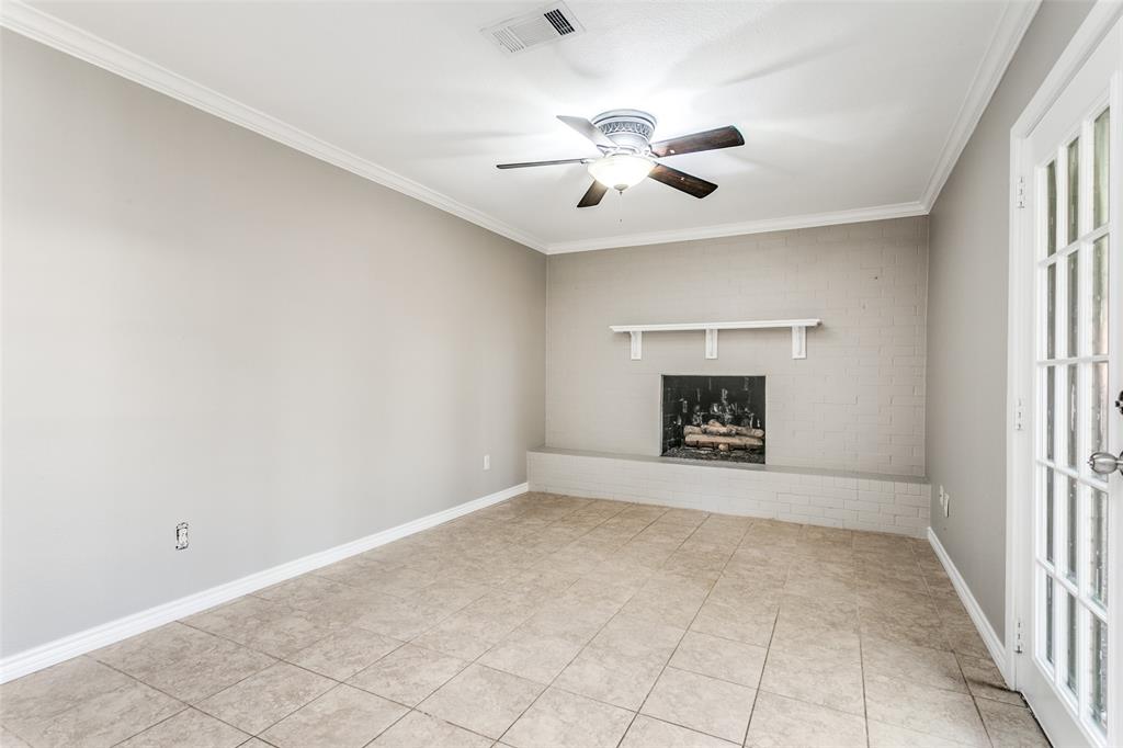 845 Lovers Lane Grapevine, TX 76051 - Photo 6 of 24 an empty room with chandelier fan and windows