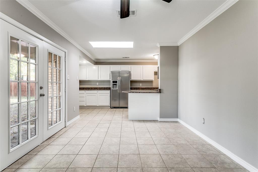 845 Lovers Lane Grapevine, TX 76051 - Photo 8 of 24 a kitchen with white cabinets and appliances