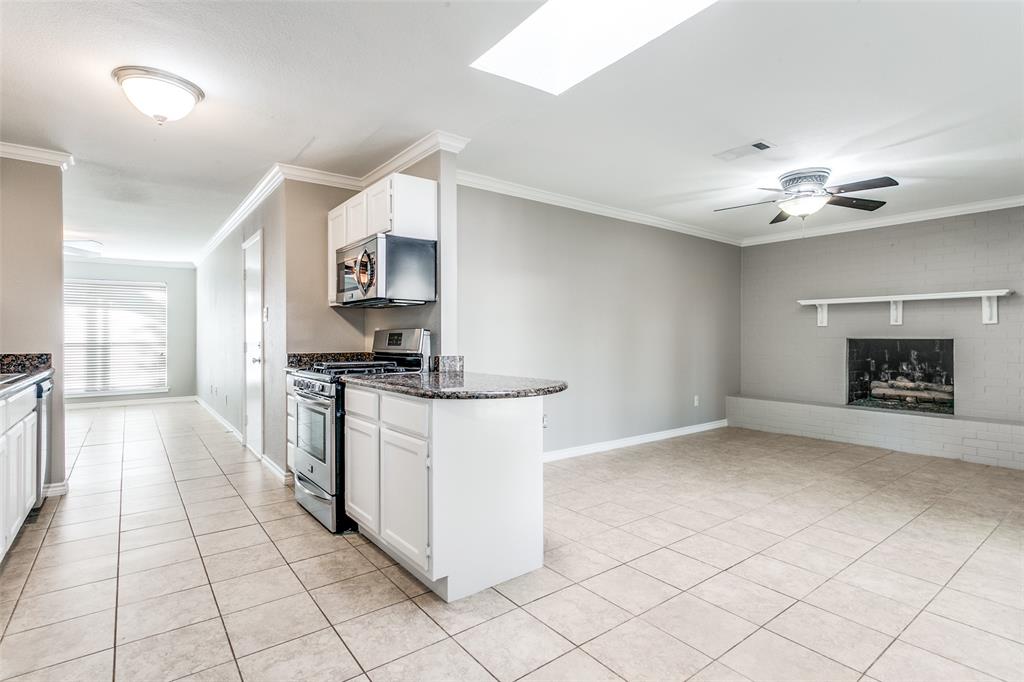 845 Lovers Lane Grapevine, TX 76051 - Photo 24 of 24 a kitchen with stainless steel appliances granite countertop a stove a sink and a refrigerator