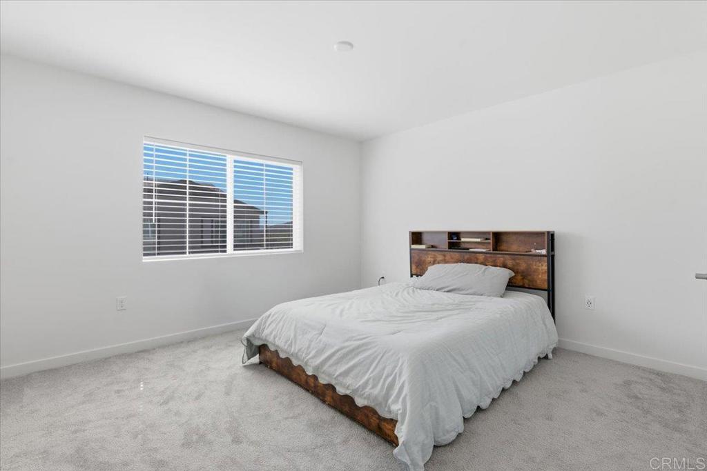 35180 Grove Trail Fallbrook, CA 92028 - Photo 14 of 23 a bedroom with a bed and window