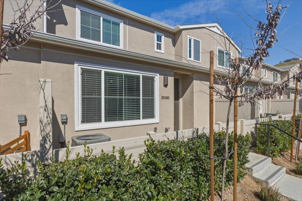 35180 Grove Trail Fallbrook, CA 92028 - Photo 4 of 23 a front view of a house with a yard