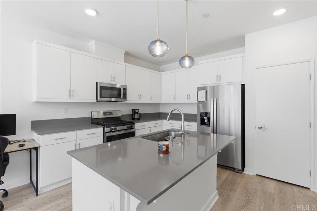35180 Grove Trail Fallbrook, CA 92028 - Photo 8 of 23 a kitchen with stainless steel appliances granite countertop a refrigerator a stove a sink a microwave and cabinets