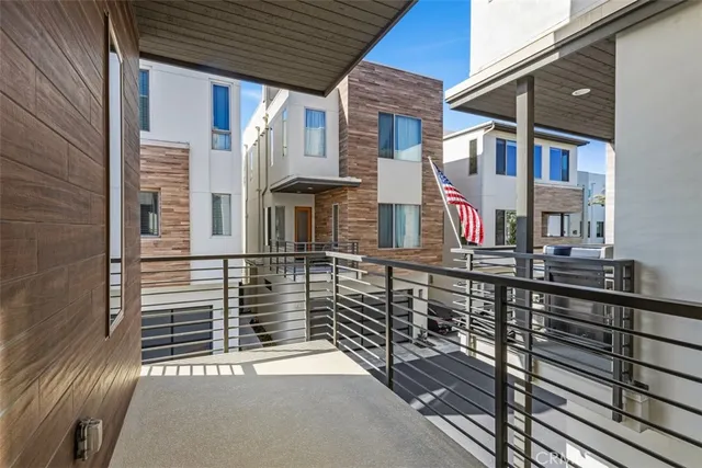 a view of a brick house with many windows