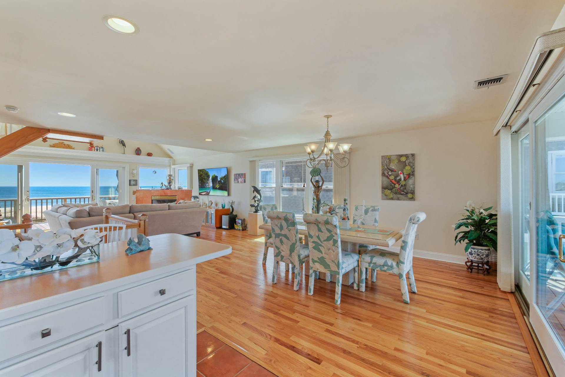 805 Dune Road Westhampton Beach, NY 11978 - Photo 11 of 25 a view of a dining room with furniture and wooden floor
