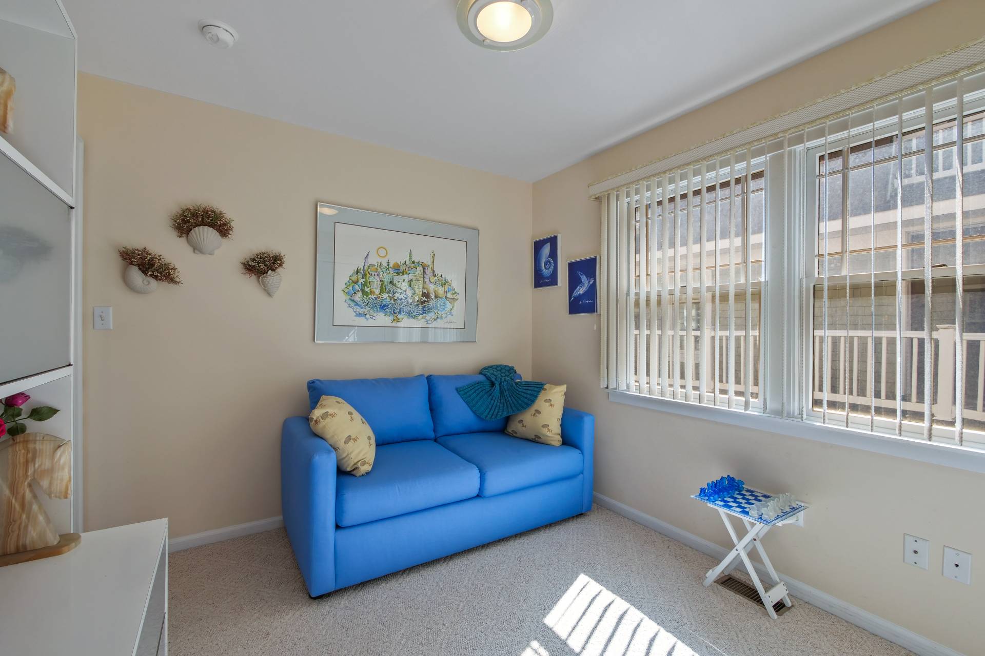 805 Dune Road Westhampton Beach, NY 11978 - Photo 14 of 25 a living room with furniture and a window