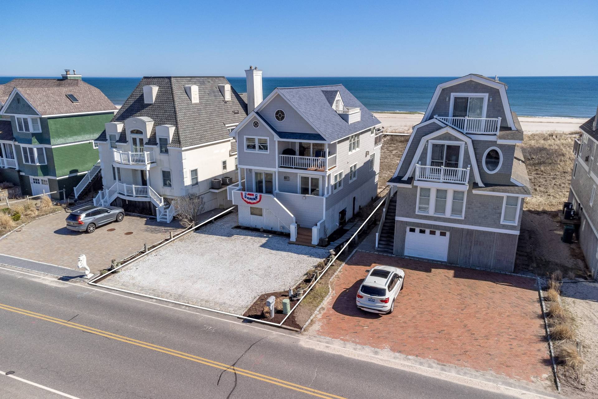 805 Dune Road Westhampton Beach, NY 11978 - Photo 2 of 25 a car parked in front of a house