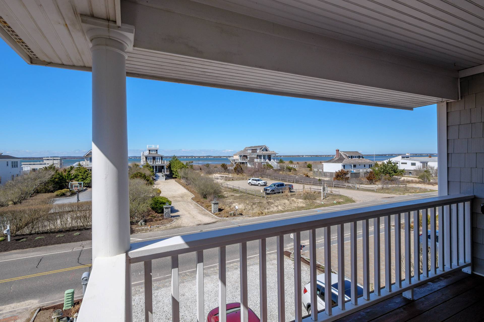 805 Dune Road Westhampton Beach, NY 11978 - Photo 21 of 25 a view of a balcony with wooden fence