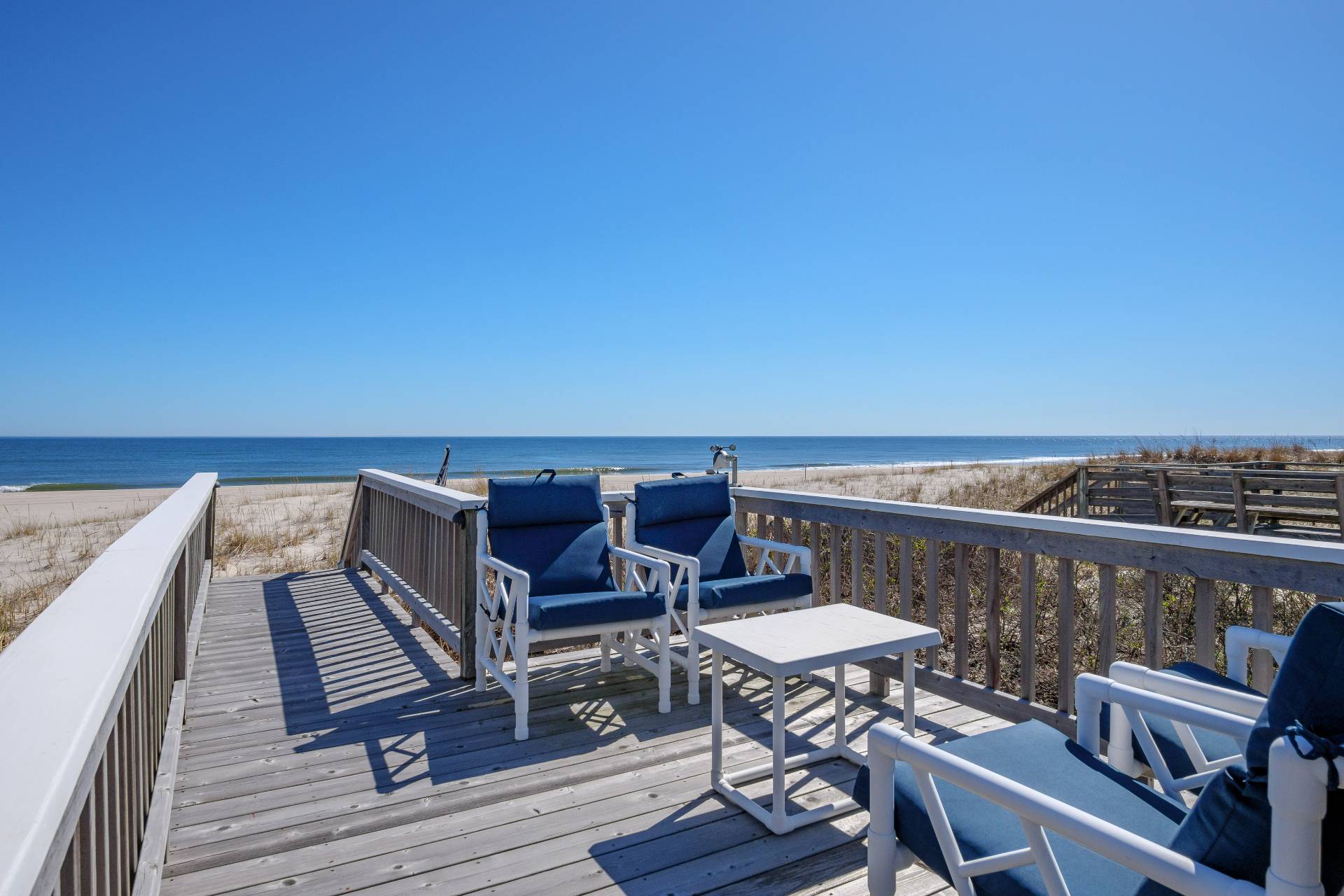 805 Dune Road Westhampton Beach, NY 11978 - Photo 25 of 25 a view of a balcony with wooden floor and outdoor seating