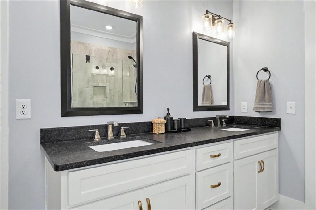943 Clubside Drive Monroe, GA 30655 - Photo 28 of 93 a bathroom with double vanity sinks and a mirror