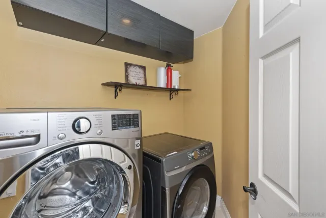 a view of a room with wooden floor and a window